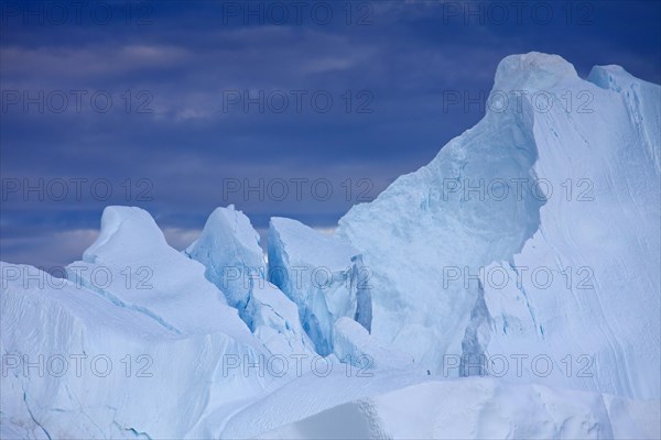 Iceberg at sunset in the Kangia icefjord