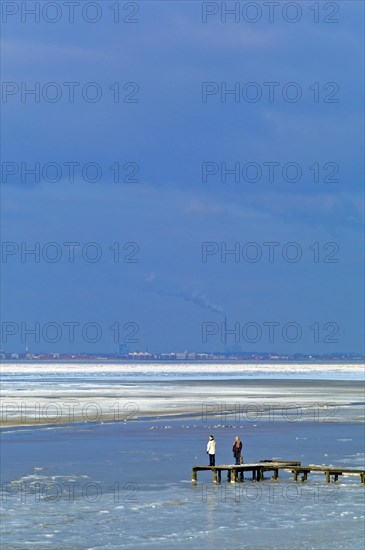 View over the frozen Jade Bay towards Wilhelmshaven