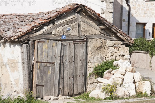 Dilapidated shed with two house numbers