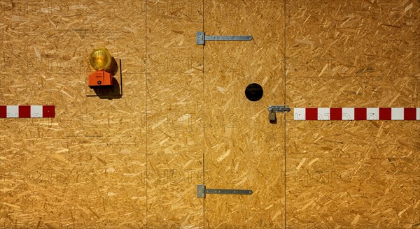 Building fence made of chipboard