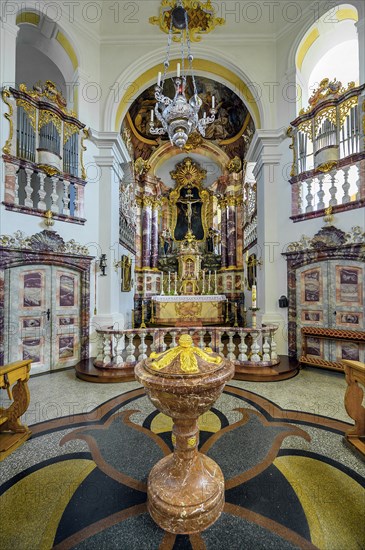 Main altar with baptismal font and side organs