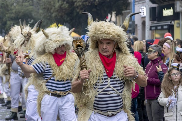 Traditional bell ringer masks in sailors mother