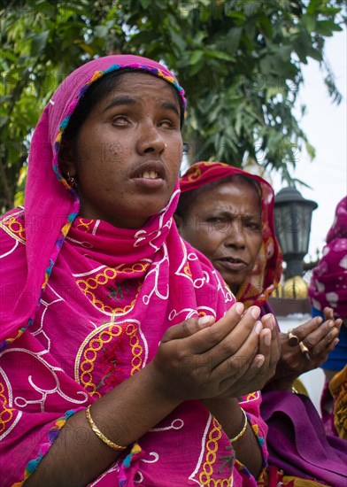 Indian Muslim women perform the second Friday prayer in the holy month of Ramadan near a Mosque in Guwahati