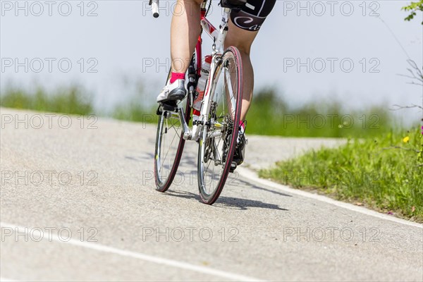 Cyclist with racing bike in the idyllic Lautertal