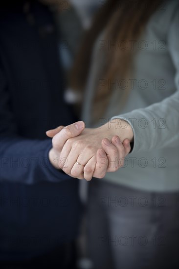 Guys couple with engagement ring.