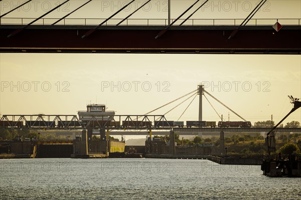 A goods train leaves the port of Constanta over a bridge. In the port of Constanta