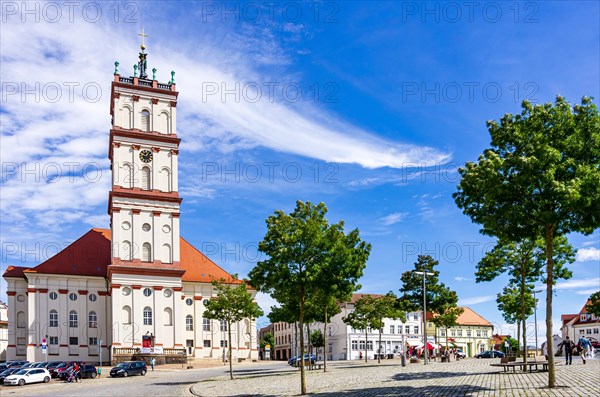 Lively scene in front of the town church on the historic market square of Neustrelitz