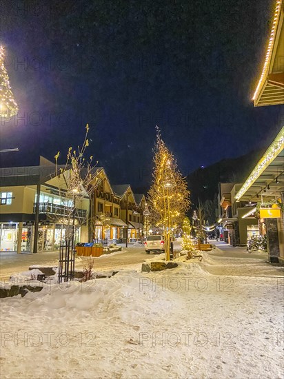 Winter street with Christmas decorations in Banff