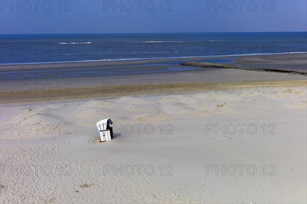 Lonely beach chair on the beach of the island of Wangerooge