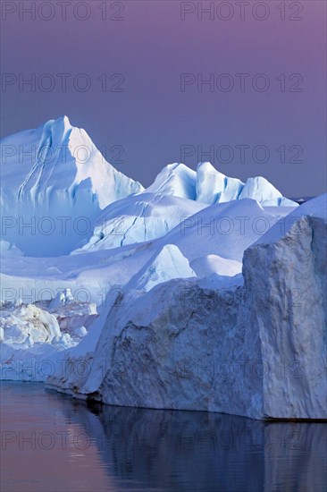 Icebergs at sunset in the Kangia icefjord