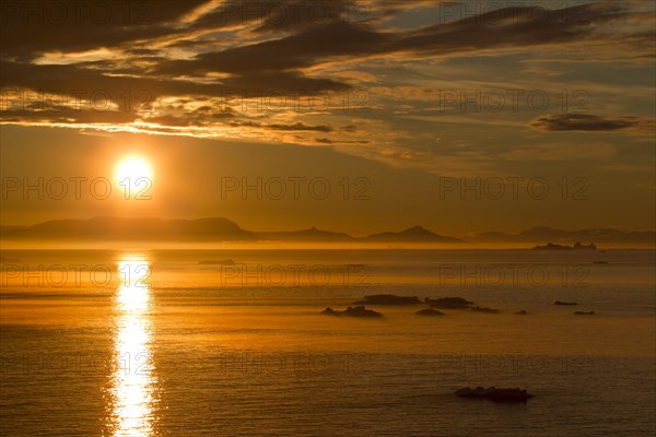 Icebergs at sunset in the Kangia Icefjord