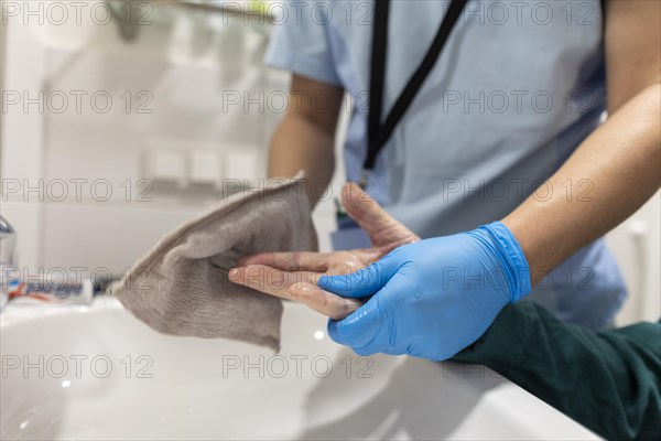 Caregiver and old man in a nursing home