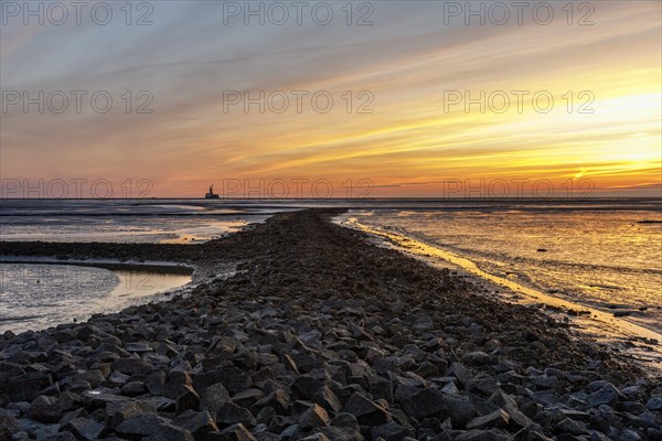 View from the Trischendamm to Germanys only drilling platform Mittelplate after sunset at low tide