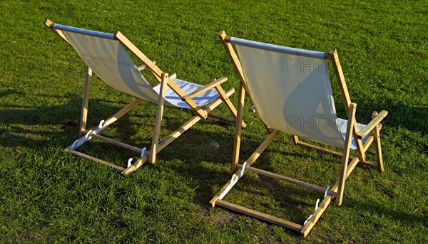 Two deckchairs on a lawn