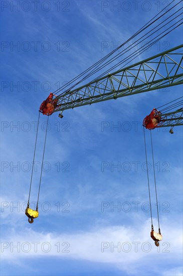 Two crane jibs with crane hooks