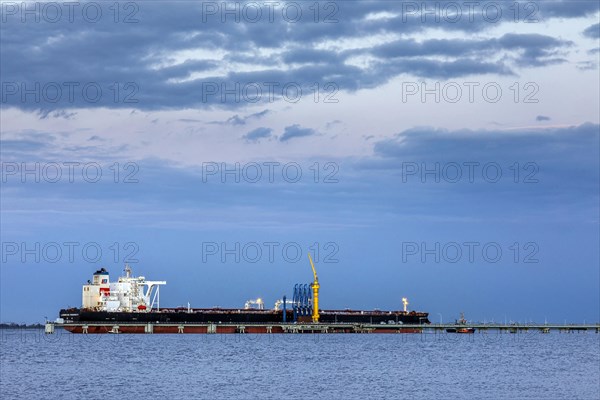 Crude oil tanker Landbridge Prosperity at the discharge bridge of the NWO in the Jade Bay