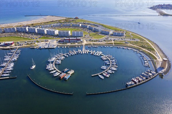 Aerial view over sailing boats docked in the Burgtiefe marina at on Fehmarn