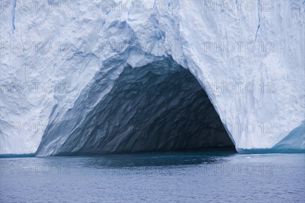 Cave in iceberg at the Kangia icefjord