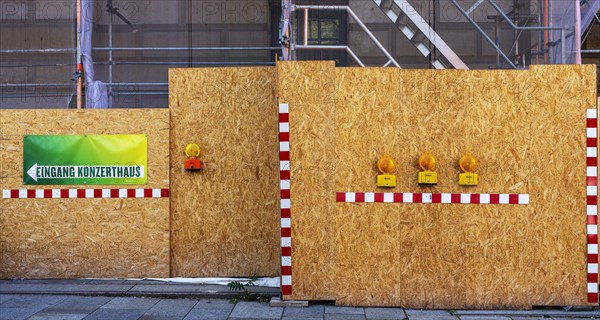 Building fence made of chipboard