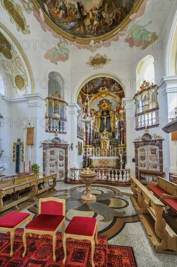 Main altar with baptismal font and side organs