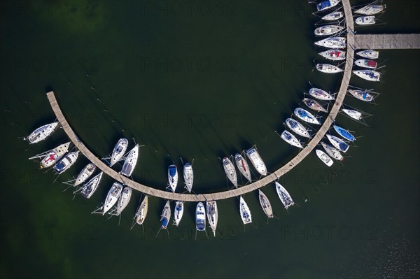 Aerial view over sailing boats docked in the Burgtiefe marina at on Fehmarn