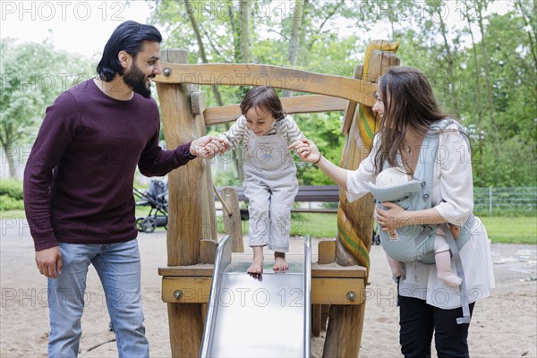 Family with children on a playground