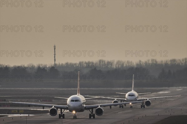Two planes taxiing over the capitals airport BER in Berlin