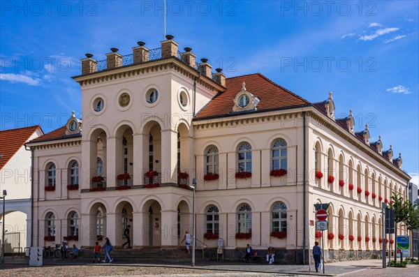 Lively scene in front of the town hall on the historic market square of Neustrelitz