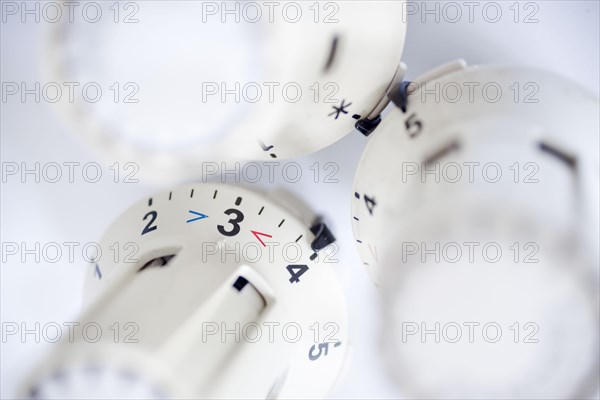 Symbolic photo on the subject of increased heating costs. Thermostats of radiators. Berlin