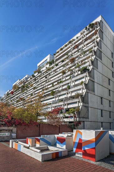 High-rise building with green balconies and art on the building in the former Olympic Village