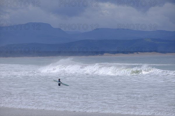 Waves on the beach with dark sky