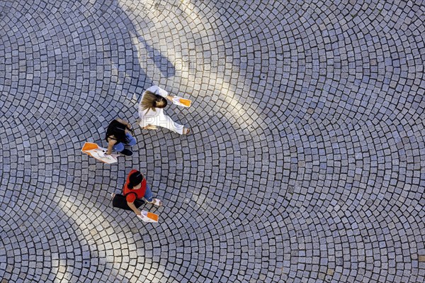 Three people from a birds eye view