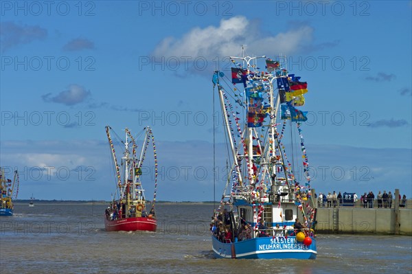 Decorated crab cutter leaving the harbour of Neuharlingersiel