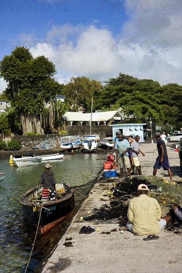 Fishermen on the quay wall