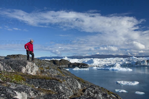 Tourist looking at Kangia Icefjord