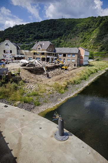 Excavators stand on a construction site in the flood-damaged village of Altenahr. Altenahr