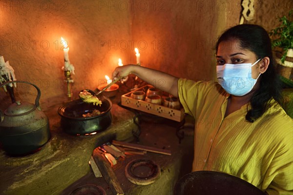 Cook at the cooking course for typical Sri Lankan kitchen