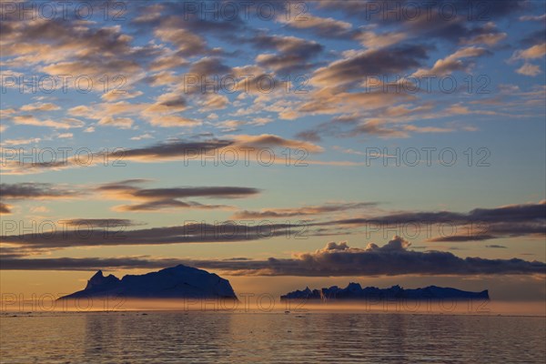 Icebergs at sunset in the Kangia Icefjord