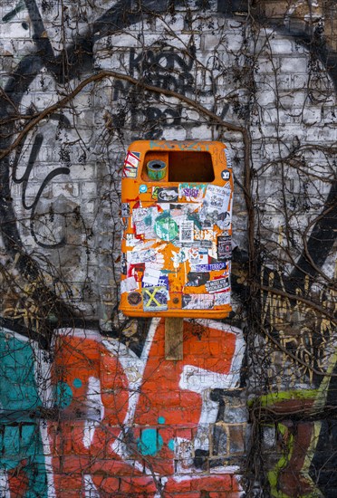 Wastepaper bin covered with stickers