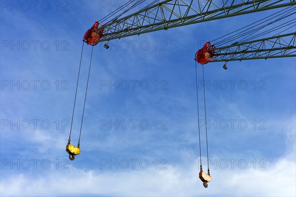 Two crane jibs with crane hooks