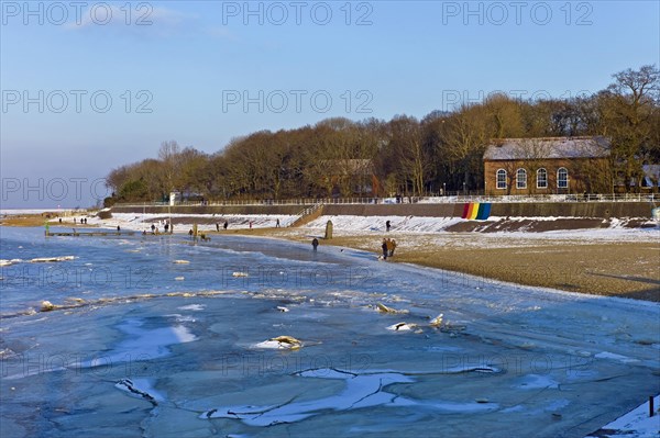 View over the frozen Jade Bay to the spa hotel in Dangast