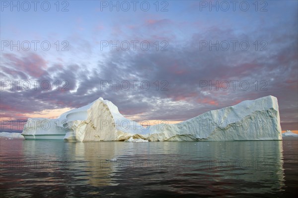 Iceberg at sunset in the Kangia icefjord