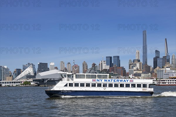 Ferry across the Hudson River in front of the USS Intreprid Sea-Air-Space Museum