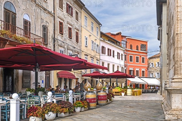 Alley with terraces of restaurants in the historic town centre of the city Pula