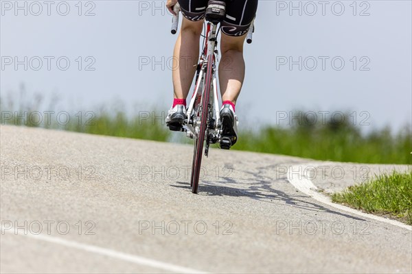 Cyclist with racing bike in the idyllic Lautertal