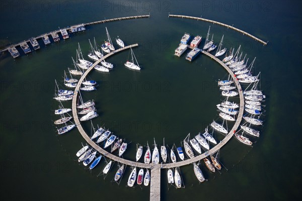 Aerial view over sailing boats docked in the Burgtiefe marina at on Fehmarn