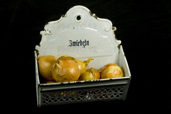 Onions in a metal onion box