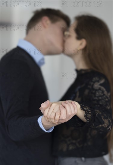 Young couple with engagement ring.