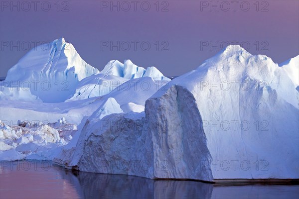 Icebergs at sunset in the Kangia icefjord