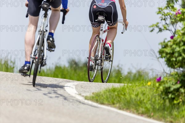 Cyclist with racing bike in the idyllic Lautertal